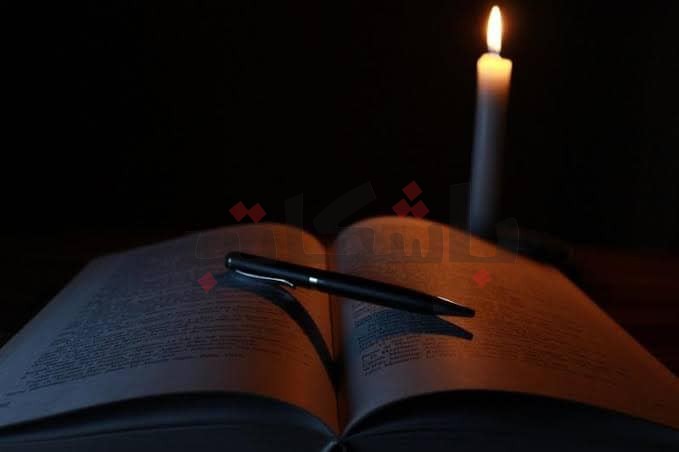 On candlelight … High School students studying for exams